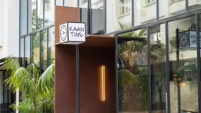 a sign in front of a glass building at Kaan Casablanca in Casablanca