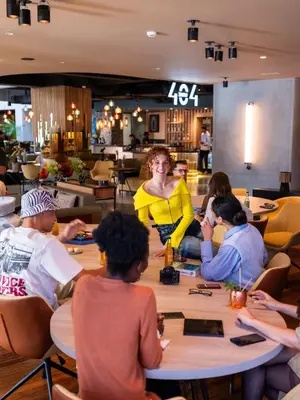 a group of people sitting around a table in a restaurant at Kaan Casablanca in Casablanca