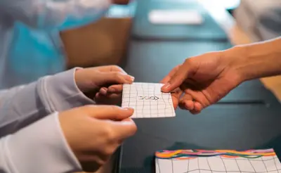 a person holding a white piece of paper at Kaan Casablanca in Casablanca