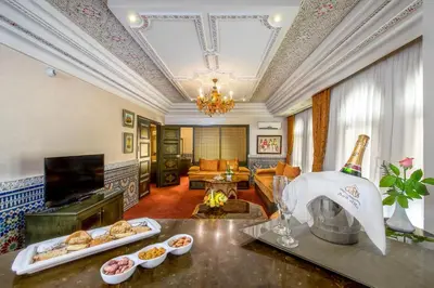 a living room with a table with food on it at Hôtel Club Val d'Anfa Casablanca Ocean view in Casablanca