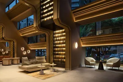 a lobby of a building with a couch and chairs at Casablanca Marriott Hotel in Casablanca