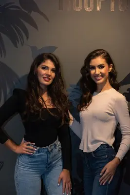 two women standing next to each other on a couch at JM Suites Hotel Eco-Friendly Casablanca in Casablanca