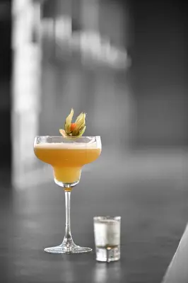a cocktail in a glass on a table at JM Suites Hotel Eco-Friendly Casablanca in Casablanca