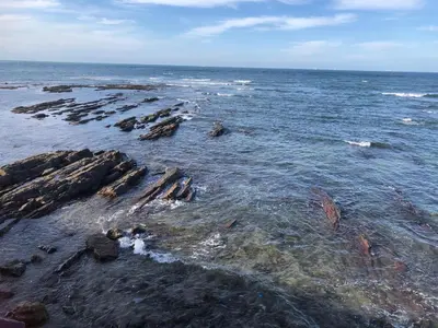 a beach with rocks in the water and the ocean at Appartement de Charme Avec Vue Sur Mer in Casablanca