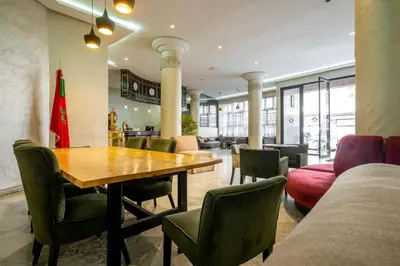 a dining room with a table and chairs at Hotel Casablanca City Center in Casablanca