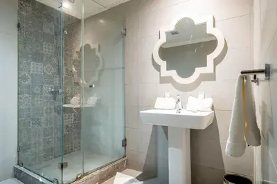 a bathroom with a sink and a shower at Hotel Casablanca City Center in Casablanca