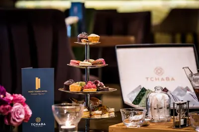 a three tiered display of muffins and pastries on a table at Kenzi Tower Hotel in Casablanca