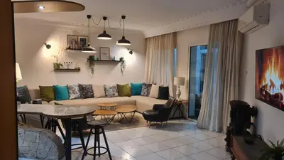 a living room with a couch and a table at Océan Beach in Tamaris