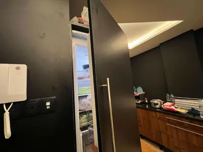 a kitchen with a refrigerator with its door open at offering a fantastic Apartment in Casablanca