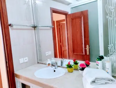 a bathroom with a sink and a mirror at Splendid appartament a 3 Min de la mer et de la mosquée hassan 2 in Casablanca