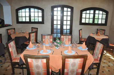 a dining room with a long table and chairs at Gite Nadia in Casablanca
