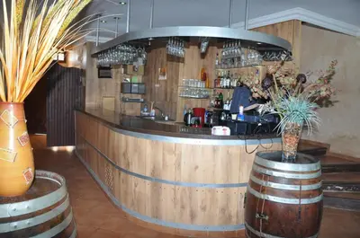 a bar in a wine cellar with barrels at Gite Nadia in Casablanca