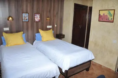 two beds sitting next to each other in a room at Gite Nadia in Casablanca