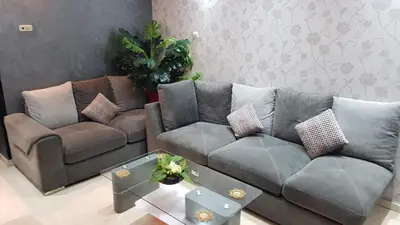 a living room with a couch and a coffee table at Deluxe apartments in Casablanca