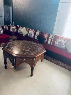 a living room with a couch and a coffee table at Deluxe apartments in Casablanca