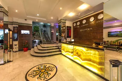a lobby with a bar in a store with clocks at Hotel Toubkal in Casablanca