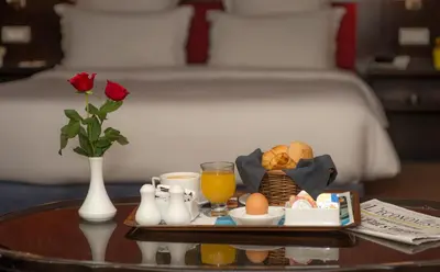 a tray of breakfast food on a table in a hotel room at Hotel Toubkal in Casablanca