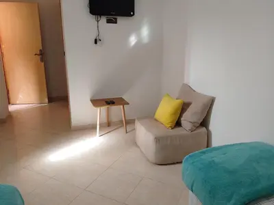 a living room with a couch and a table at Dar Ziyad Airport in Casablanca