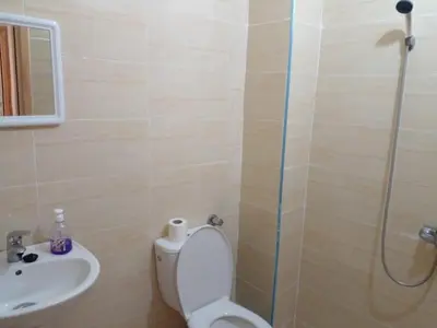 a bathroom with a toilet and a sink and a shower at Dar Ziyad Airport in Casablanca