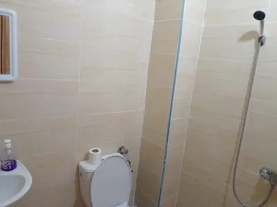 a bathroom with a toilet and a shower and a sink at Dar Ziyad Airport in Casablanca