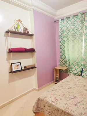 a bedroom with a bed and a window at Appartement propre et bien équipé à Ain sebaa in Casablanca