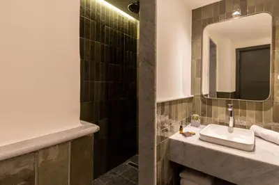 a bathroom with a sink and a mirror at Best Western Plus Casablanca City Center in Casablanca