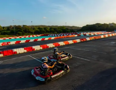 two people are riding down a race track on rapids at Mazagan Beach & Golf Resort in El Jadida