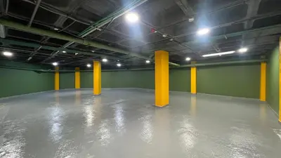 a large room with yellow poles in a green wall at ZEN Suites Hotel Massira in Casablanca