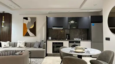a living room with a couch and a table at Charming and Central 2 Bedrooms - By AppartAli in Casablanca