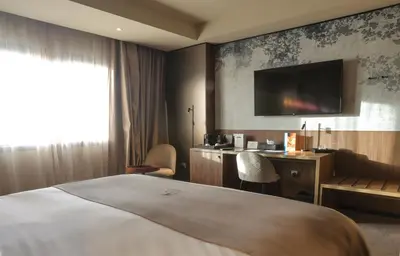 a hotel room with a bed and a desk at Villa Blanca Urban Hotel in Casablanca