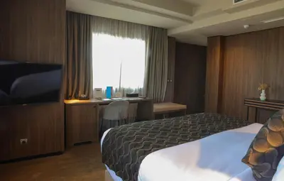 a hotel room with a bed and a window at Villa Blanca Urban Hotel in Casablanca