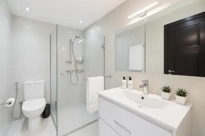 a bathroom with a toilet and a sink and a shower at Architects Haven in Luxury 3BR - Near Train & Tramway in Casablanca