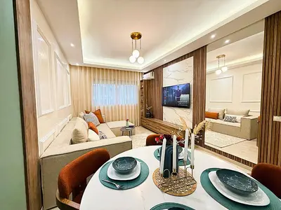 a living room with a table and a living room at Architects Haven in Luxury 3BR - Near Train & Tramway in Casablanca