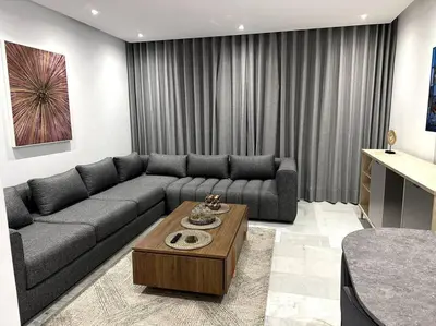 a living room with a couch and a coffee table at Casa by Casablanca in Casablanca