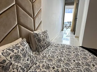 a bed with two pillows on top of it at Casa by Casablanca in Casablanca