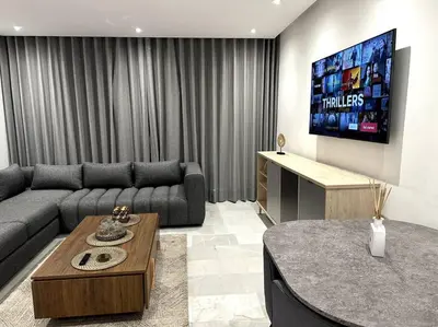 a living room with a couch and a flat screen tv at Casa by Casablanca in Casablanca