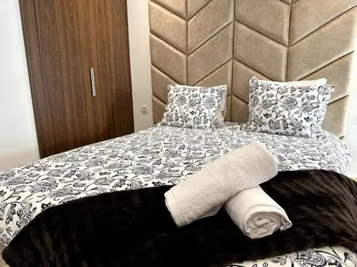 a bedroom with a bed with towels on it at Casa by Casablanca in Casablanca