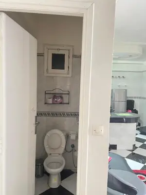 a bathroom with a toilet in a room at Housse F2 famille in Rabat