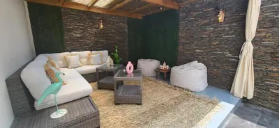 a rendering of a living room with a couch and tables at L'Amouage Casablanca Location Journalière Casablanca in Casablanca